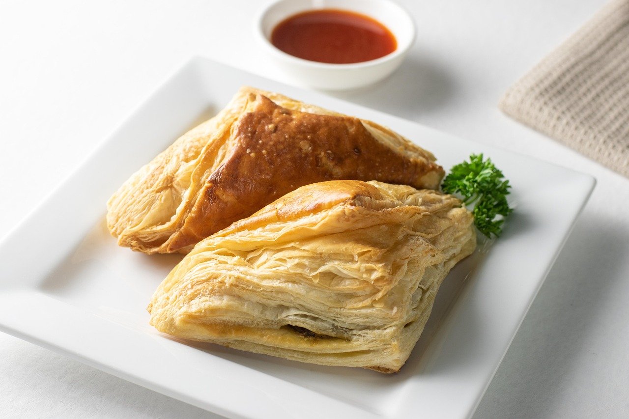 Golden Flaky Puff Pastry with Dipping Sauce - Ko Lake Villa boutique lakefront accommodation on Koggala Lake Sri Lanka: Delicious golden brown puff pastry, perfectly flaky and served with a zesty dipping sauce. Ideal for breakfast, snacks, or a sweet treat. Purchased from specialist local bakers. sourdough, croissants and other specialities.