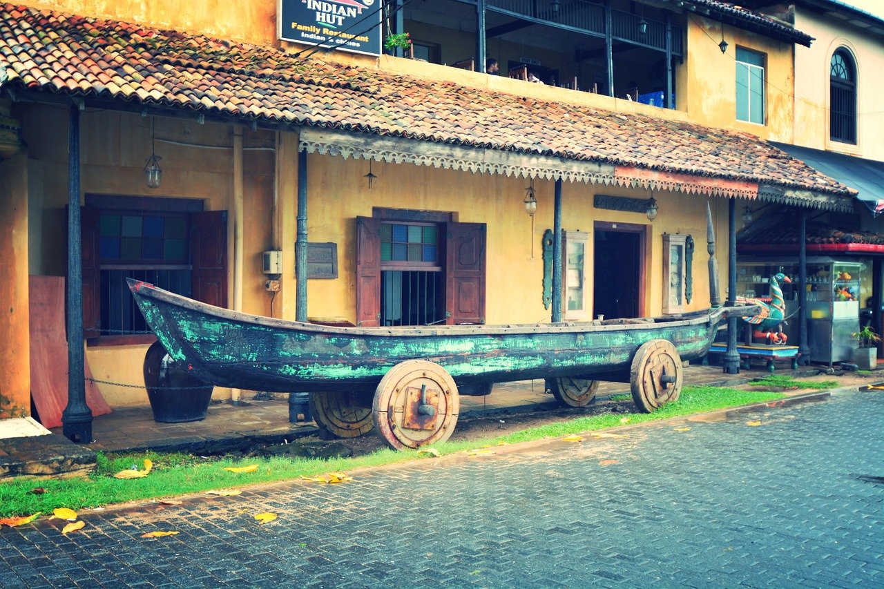 Rustic Boat Art - Sri Lankan Street Decor - Ko Lake Villa boutique lakefront accommodation on Koggala Lake Sri Lanka: Discover a unique, rustic boat on wheels used as street art in Sri Lanka. Blends local culture with vintage charm.