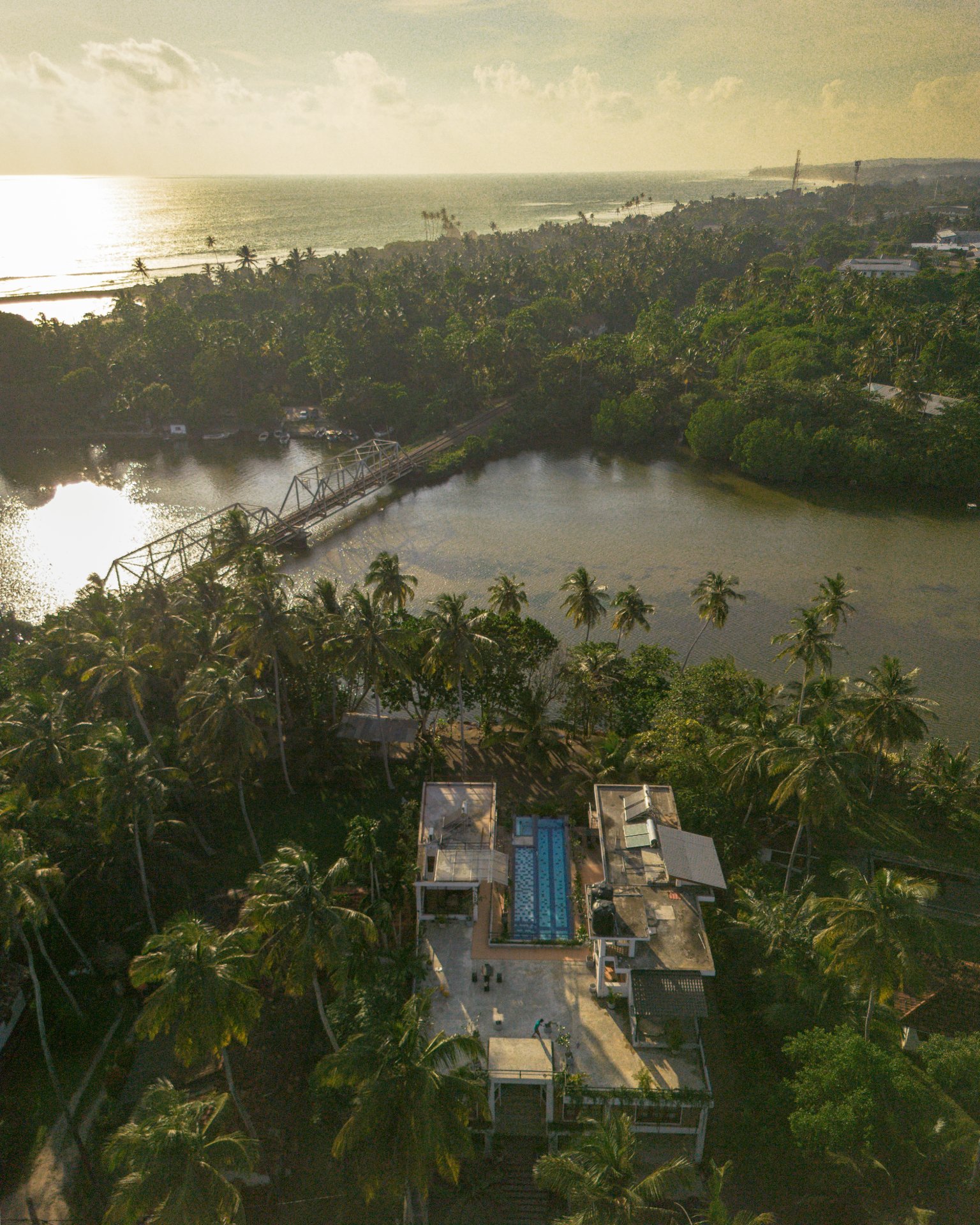 Drone KoLake Sunset - Ko Lake Villa boutique lakefront accommodation on Koggala Lake Sri Lanka: A drone view of Ko Lake pool roofgarden sunset view