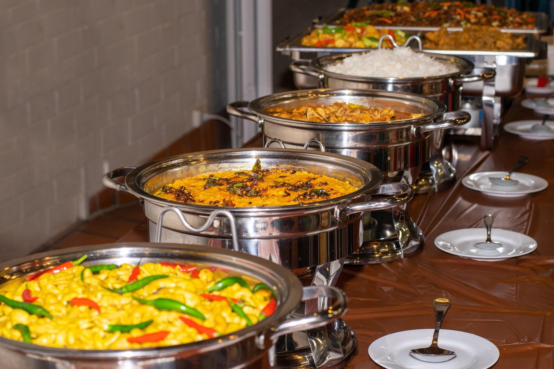 Delicious Sri Laka Buffet - Ko Lake Villa boutique lakefront accommodation on Koggala Lake Sri Lanka: Ko Lake copes with large evets withvibrant array of local cuisine in buffet chafer dishes, featuring rice, curries, and dal. Perfect for events & catering!