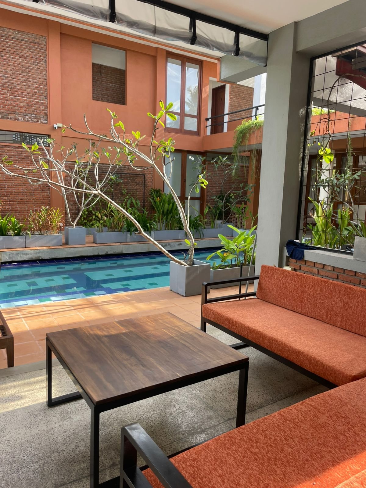Poolside Sofa seating - Ko Lake Villa boutique lakefront accommodation on Koggala Lake Sri Lanka: Poolside social Sofa Coffee Tables cool breeze from lake