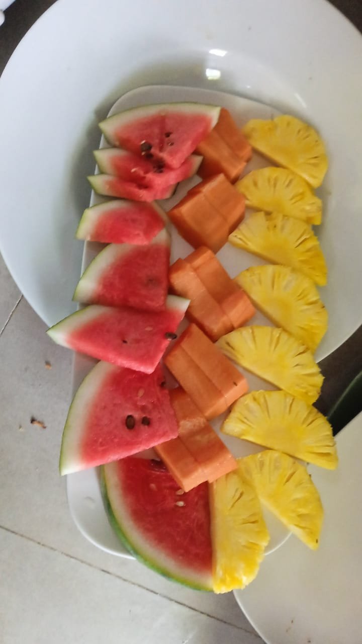Fresh Fruit Platter: Watermelon, Papaya & Pineapple - Ko Lake Villa boutique lakefront accommodation on Koggala Lake Sri Lanka: Healthy and vibrant fruit platter featuring slices of juicy watermelon, ripe papaya chunks, and sweet pineapple wedges. Perfect for a refreshing snack!