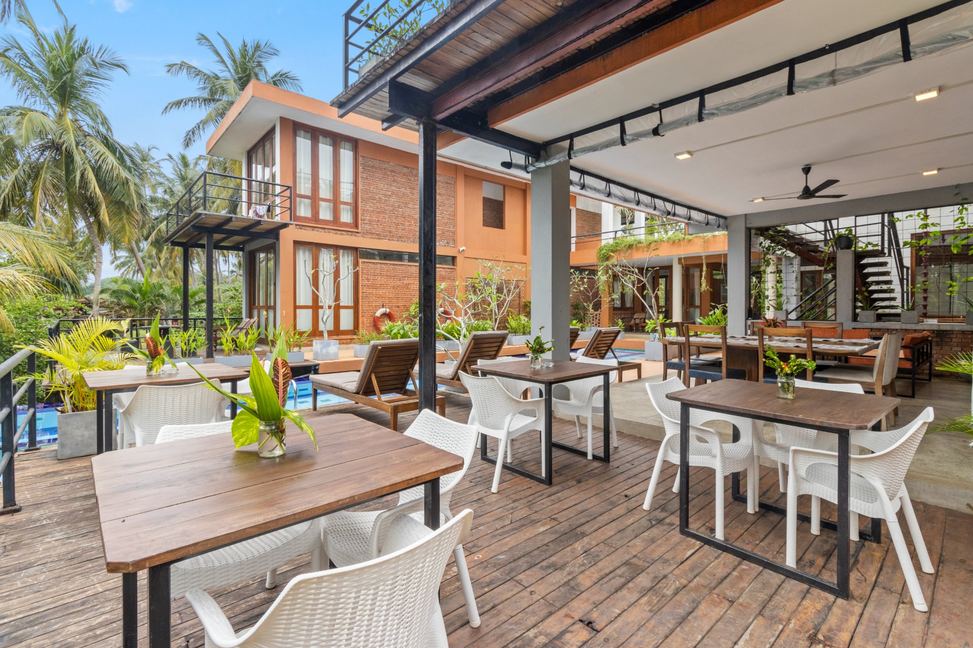 Tropical Resort Dining: Poolside Restaurant & Bar - Ko Lake Villa boutique lakefront accommodation on Koggala Lake Sri Lanka: Experience open-air dining at our tropical resort. Enjoy delicious meals by the pool with lush palm trees and stunning architecture.